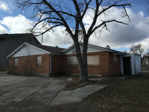 Former Housing Authority building with windows and entrance