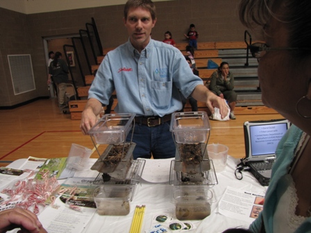 Man talking with a woman about rainfall simulations